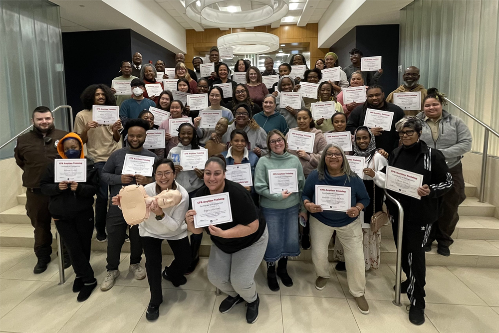 2024 COHERE Trainees with Boston EMS completing CPR training