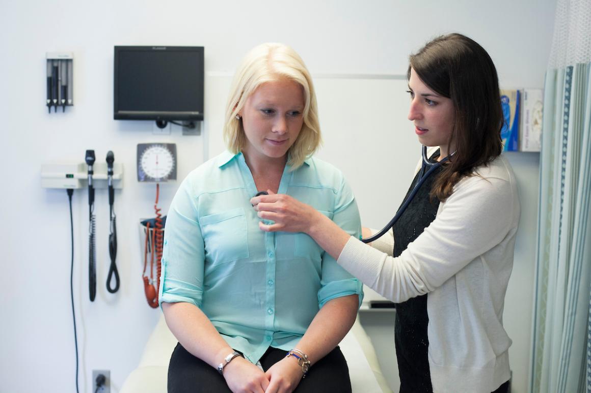 Tufts PA student checking patient's heart