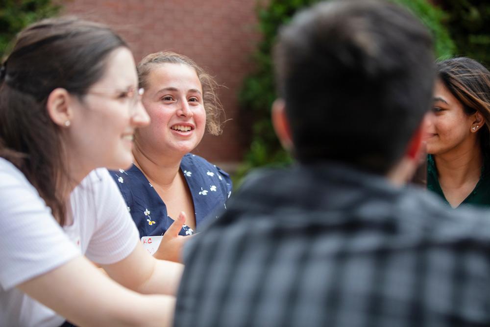 Students sitting and chatting during orientation