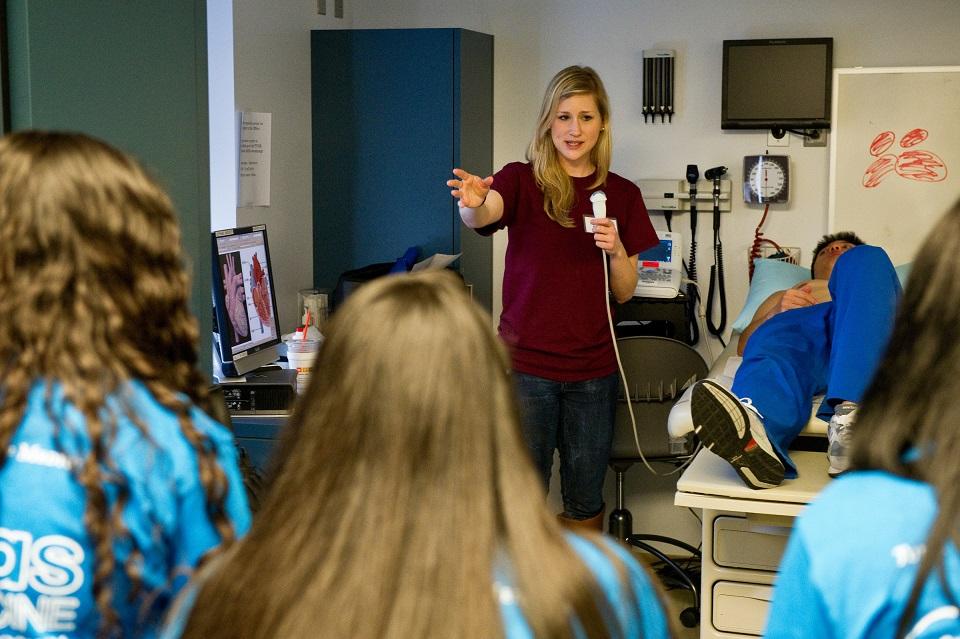 MD student talking to high school students
