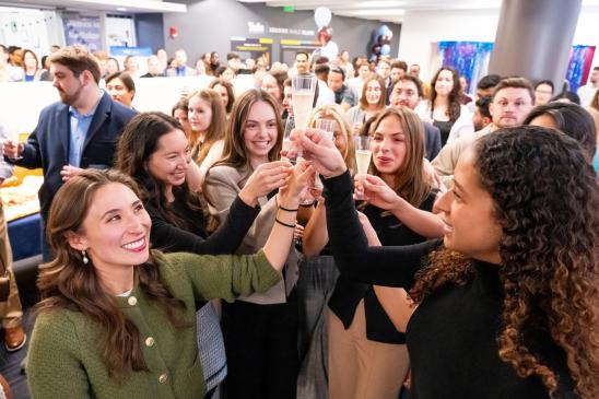 Medical students raise a glass and toast to their Match Day results.