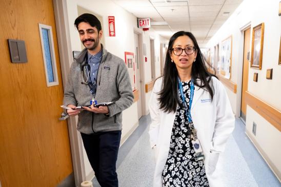 02/10/2025 - Boston, Mass. - Ed Hasaba, M25, works with Dr. Amanda Von Horn, Assistant Professor of Psychiatry, as he and a group of residents and fellow students conduct rounds in the Addiction Medicine rotation at Tufts Medical Center on February 10, 2025. (Alonso Nichols/Tufts University)