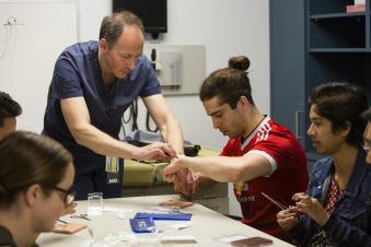 Medical students practicing clinical skills in the Simulation Center