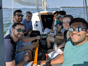 Andrew Bohm on a boat with students