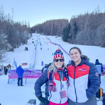Galley and Thorr on a mountain while in ski gear