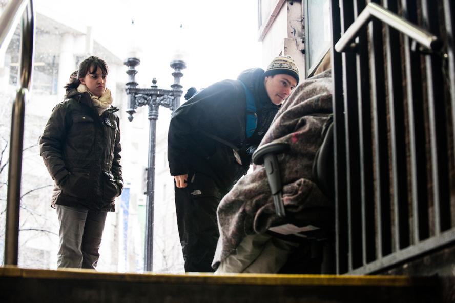 Rebecca Lee, M16, and Dr. David Munson, M09 reach out to homeless people on the streets of Boston.
