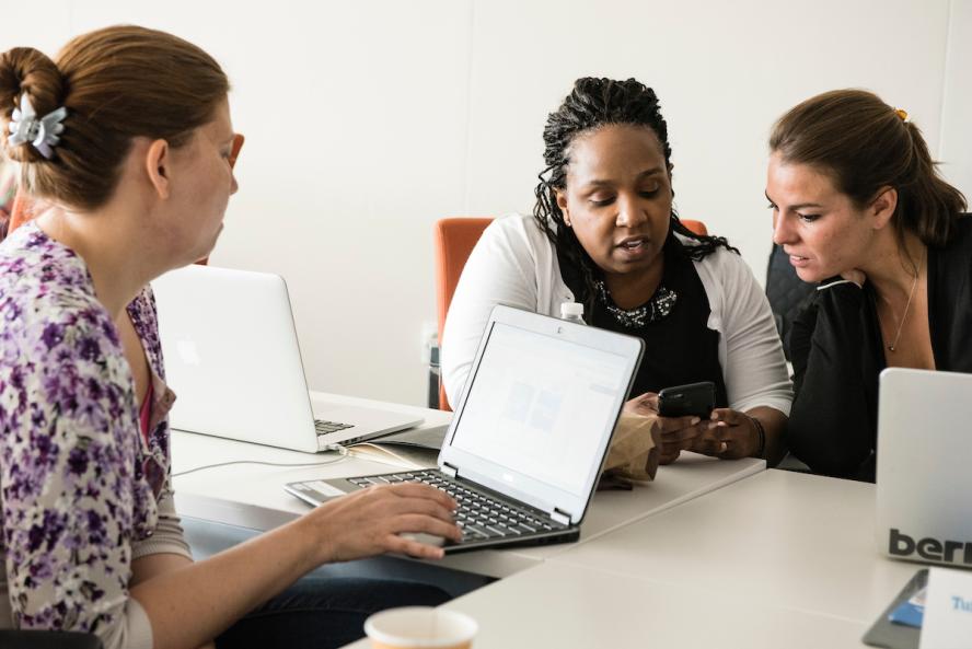 MPH students work collaborative white at a table in Tufts University MPH Program