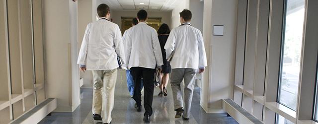 med students walking in the hall