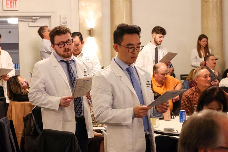 DPT-Boston students taking their professional oath at graduation reception.