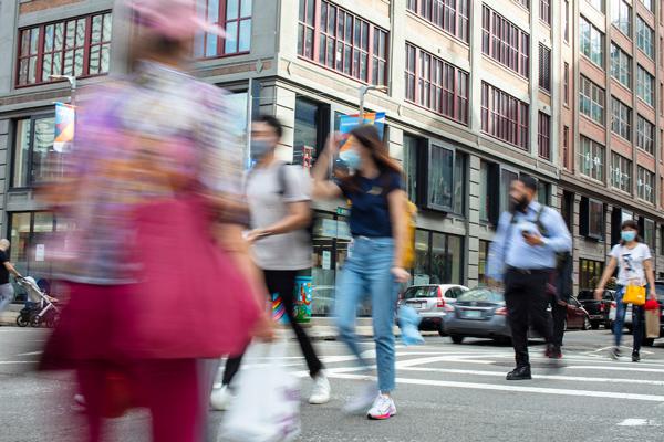 People walking on the street in downtown Boston by Tufts University's MPH programs
