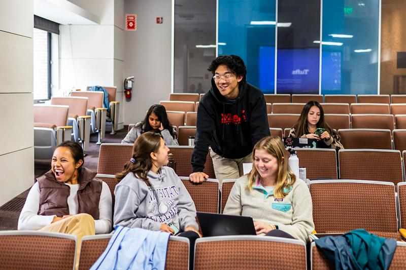 Group of students sitting and chatting before class