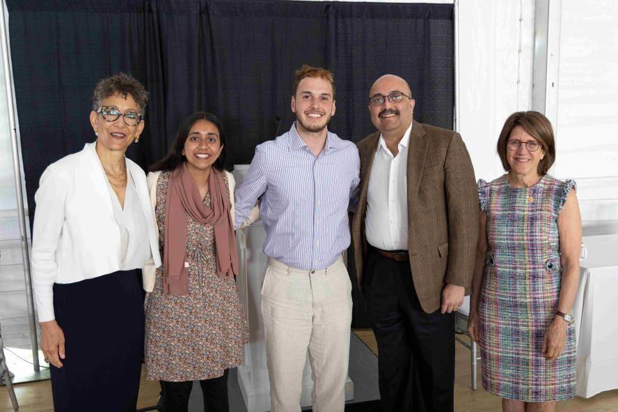 Left to Right: Dayna Cunningham, Pierre and Pamela Omidyar Dean of Tisch College; Senila Yasmin, M25; Michael Zarra, M25; President Sunil Kumar; and Amy Kuhlik, dean for student affairs at TUSM