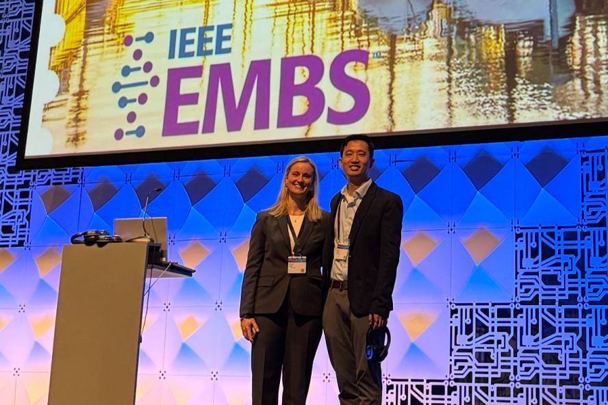 Assistant Professor Brooke Krbec and her collaborator, MIT Research Scientist Dr. Xiang (Shawn) Zhang, presenting at a conference in Copenhagen, Denmark.