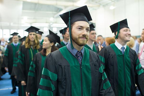 Jason T. Szelog processes with his classmates during the Phase II Commencement ceremony for the Tufts School of Medicine