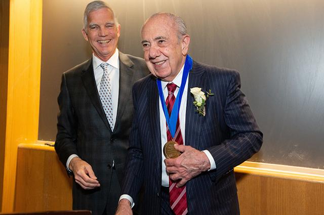 Peter Bates, interim dean of the School of Medicine, presented a Dean’s Medal to cardiologist Deeb Salem on May 21. Photo: Matthew Healey