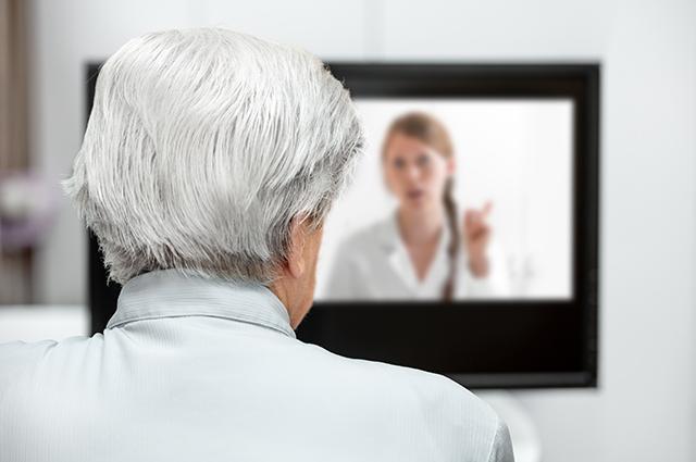 Patient consults telemedicine doctor