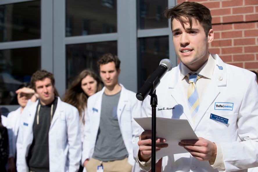 Tufts students in white coats at Parkland Rally. Photo: Alonso Nichols