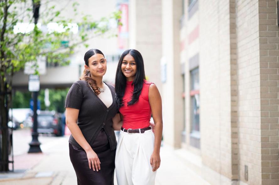 Nafisa Munawarah, A23, M28, and Ameya Menta, A23, M28, stand outside of Tufts University School of Medicine in Boston.