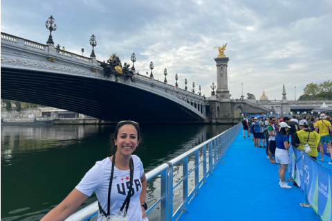 Shefali poses by bridge overlooking Paris
