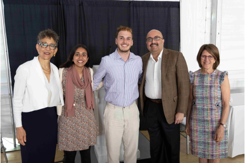 Left to Right: Dayna Cunningham, Pierre and Pamela Omidyar Dean of Tisch College; Senila Yasmin, M25; Michael Zarra, M25; President Sunil Kumar; and Amy Kuhlik, dean for student affairs at TUSM