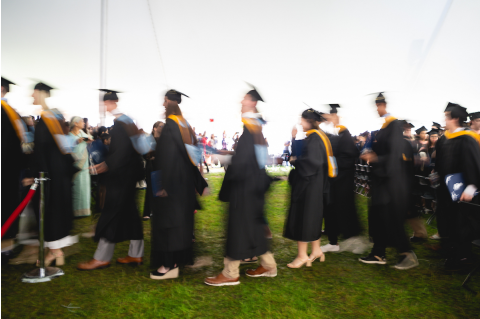 Students walking at Commencement 2025
