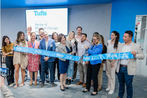Tufts faculty and students cutting ribbon at the DPT-Phoenix grand opening.