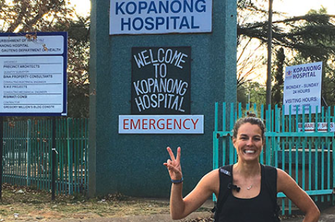 Tufts PA student Elizabeth Huebner at the entrance to Kopanong Hospital