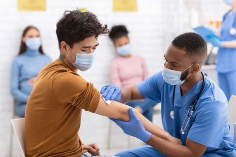 A health care worker prepares to give a vaccination shot. A new Tufts study looked at the change in people’s attitudes toward the COVID-19 vaccine over the first few months of the year. 