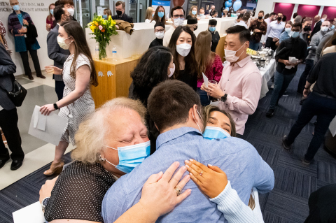 Michael Mastroianni, M22, hugs his family on Match Day at Tufts School of Medicine. Photo: Alonso Nichols / Tufts University