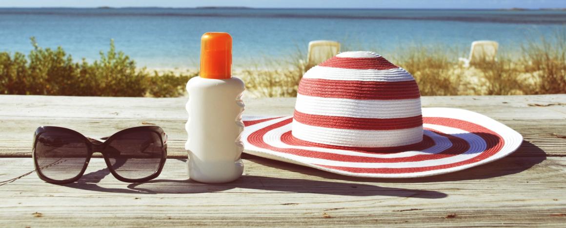 sunglass, sunscreen and a sun hat 