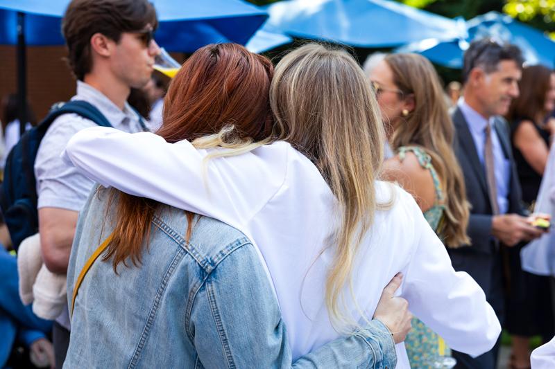 Student hugs friend