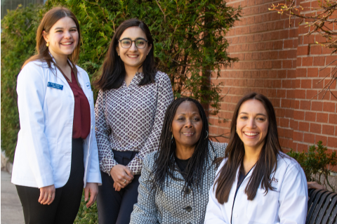Students from the Tufts University Boston health sciences campus with the Office of Student Wellness director. From left to right: Abby Lemons, GBS27, Naina Qayyum, N27, Snaggs Gendron, and Michelle Simonds, D26. Photo by Alonso Nichols